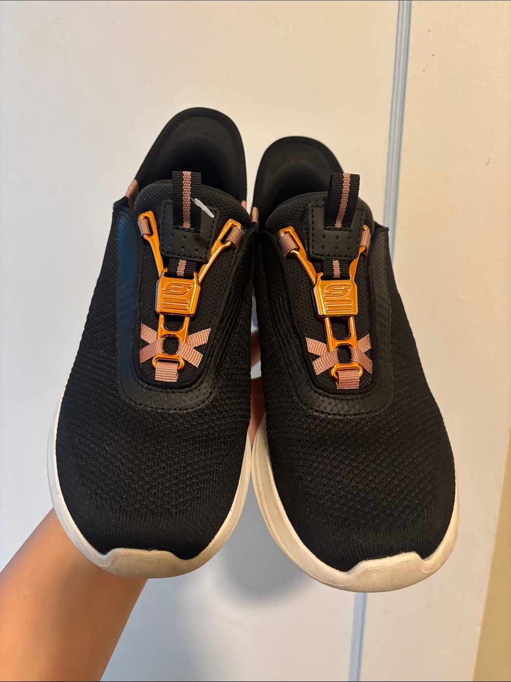 Skechers Black Slip-On Sneakers with Orange Accents